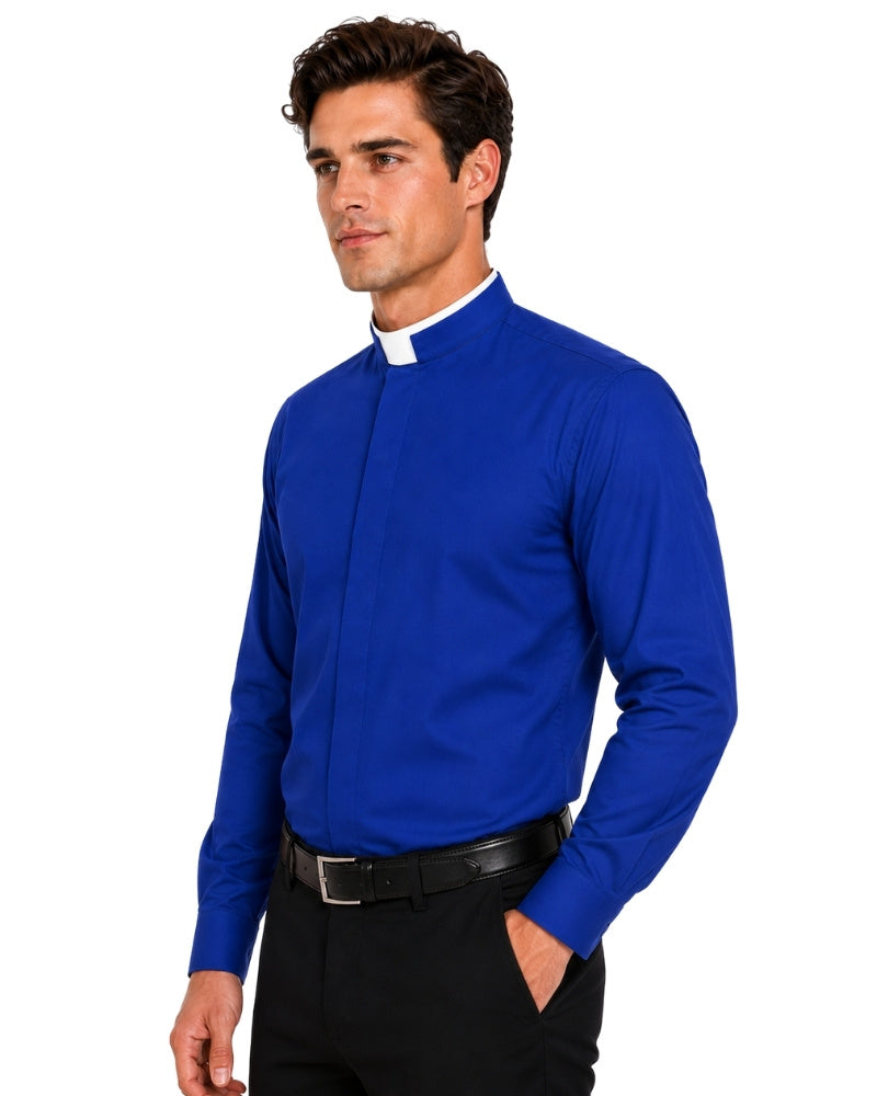 A man wearing a royal blue long-sleeve clerical shirt with a white collar, paired with black trousers and a black belt, photographed against a solid white background.
