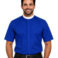A smiling man wearing a royal blue short-sleeve clerical shirt with a white collar, paired with black trousers and a black belt, against a plain white background.