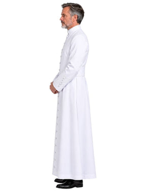 A man in profile wearing a White Clergy Cassock with a high collar and black dress shoes, photographed against a plain white background.