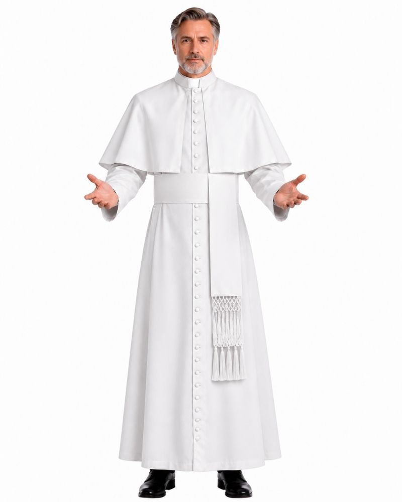 A man modeling a White Saint Cassock With Shoulder Cape, a matching waist sash with decorative fringe, and a white collar, set against a plain white background.
