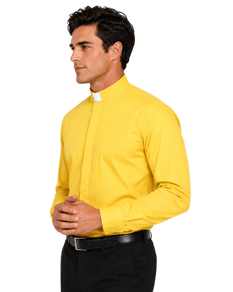 A man wearing a yellow button-down clerical shirt with a high mock neck, paired with black trousers and a black belt, against a plain white background.
