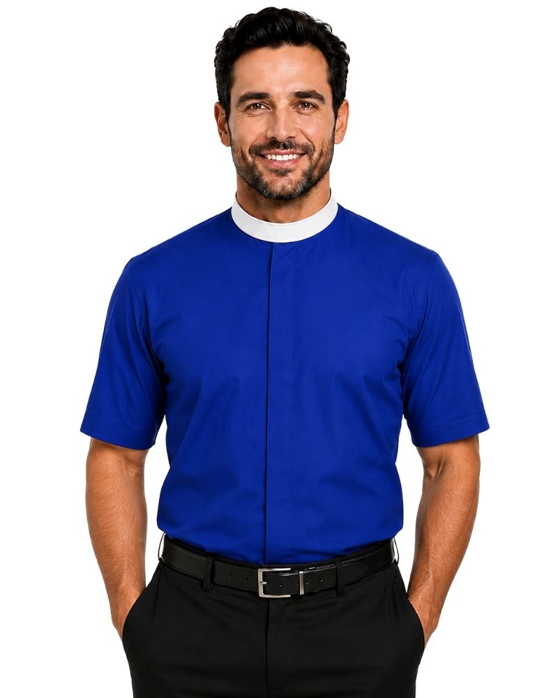 A smiling man wearing a royal blue short-sleeve clerical shirt with a white collar, paired with black trousers and a black belt, against a plain white background.