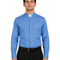 Man wearing a blue clerical shirt with a white collar against a white background
