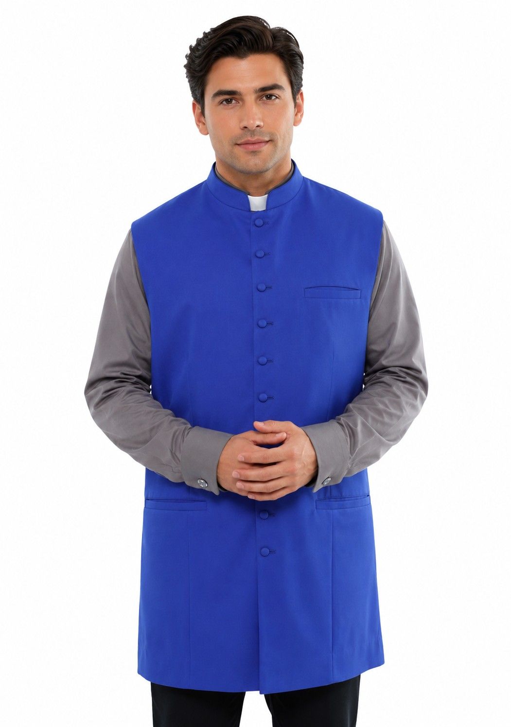 Man wearing a blue vest over a gray shirt on a white background