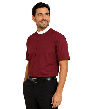 Man wearing a brown clerical shirt with a white collar on a white background
