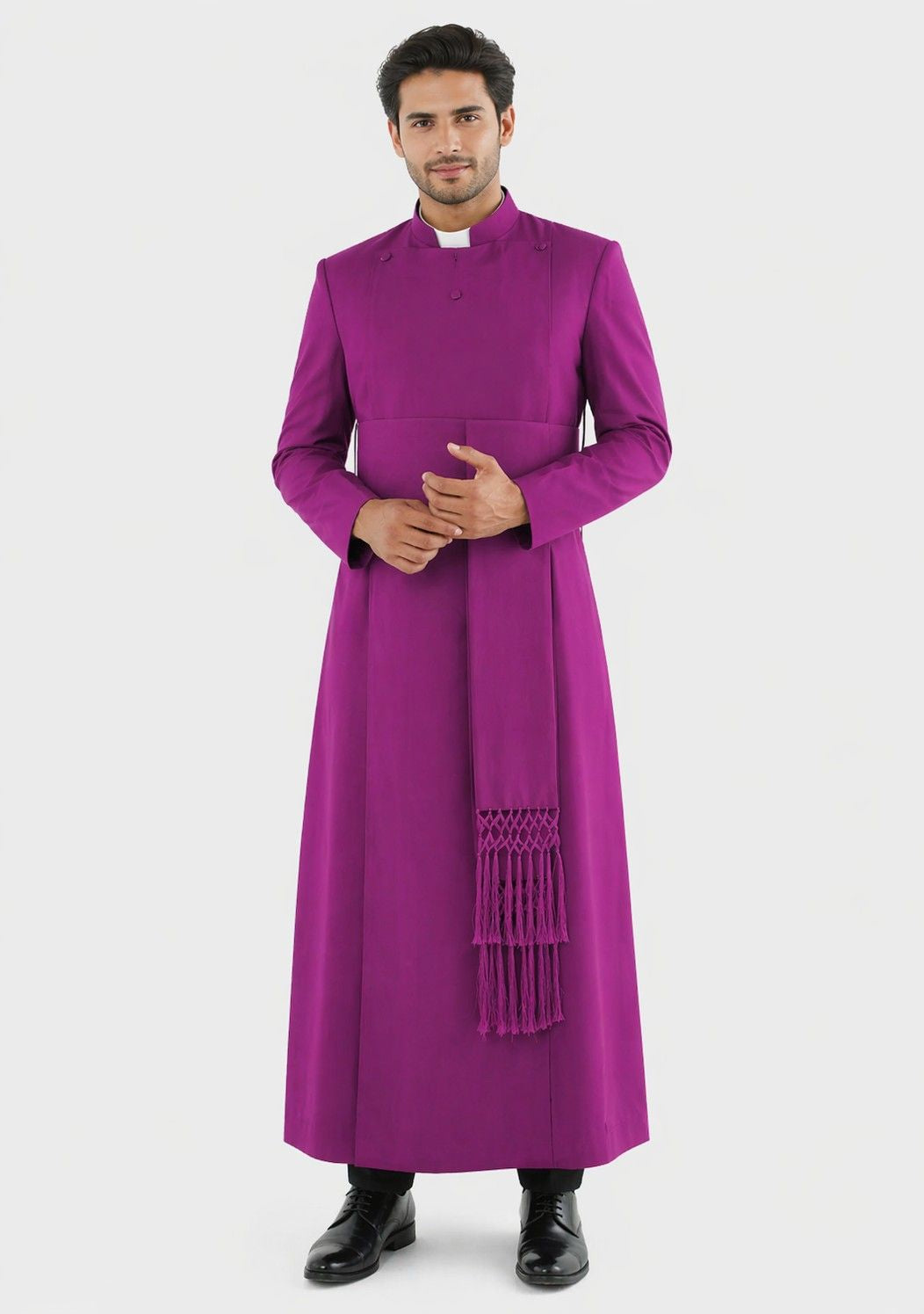 Man wearing a purple robe with a stole on a white background
