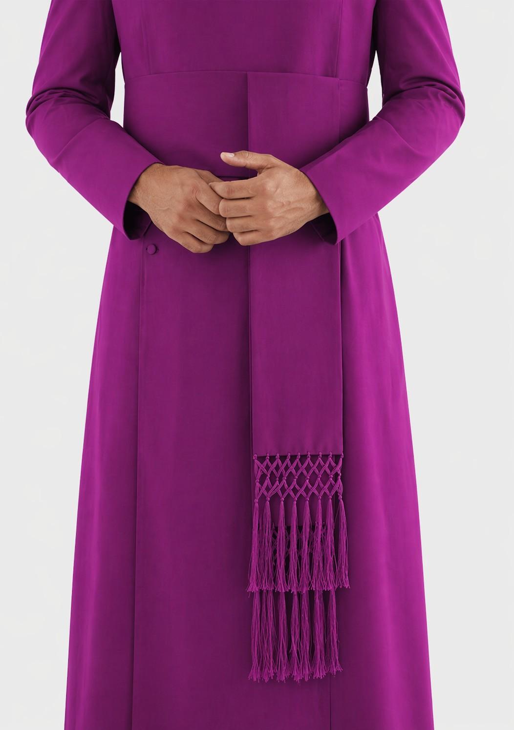 Purple dress with a matching scarf featuring fringe details on a white background