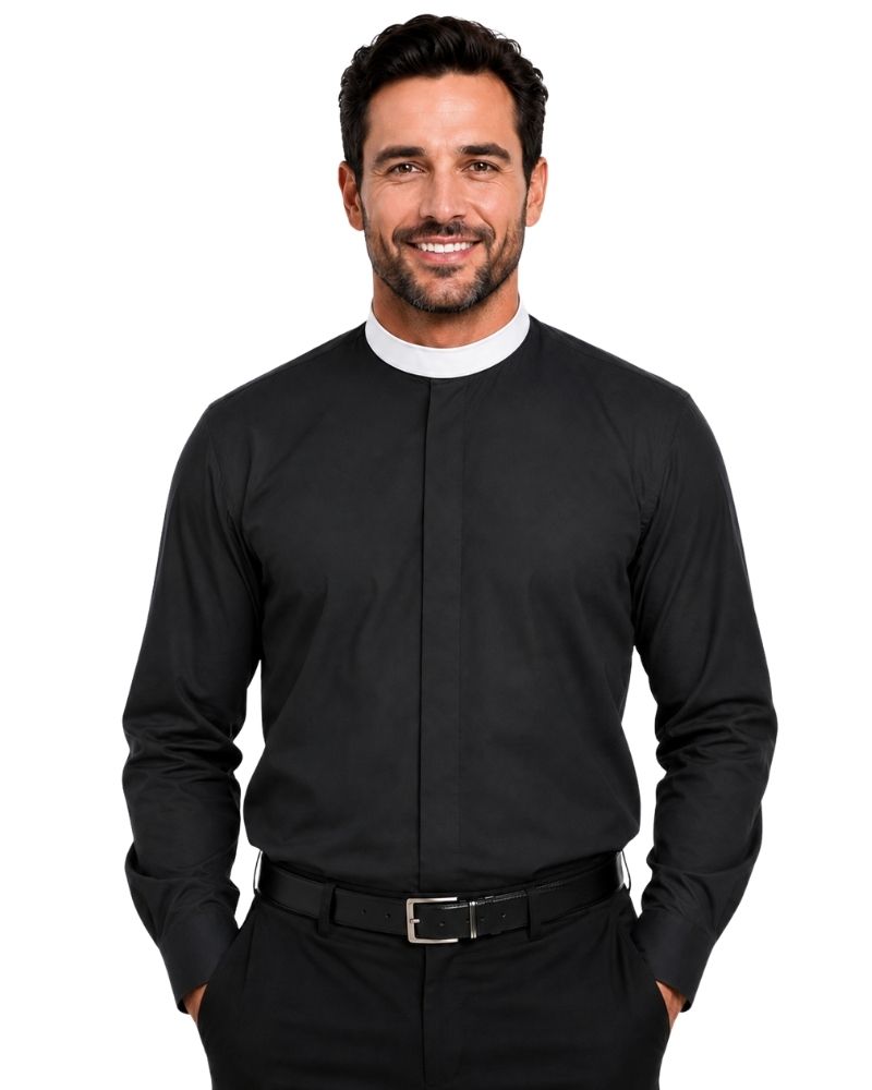 A smiling man wearing a black long-sleeve clerical shirt with a white collar, paired with black trousers and a black belt, against a plain white background.