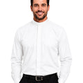 Man wearing a white dress shirt and black pants on a white background