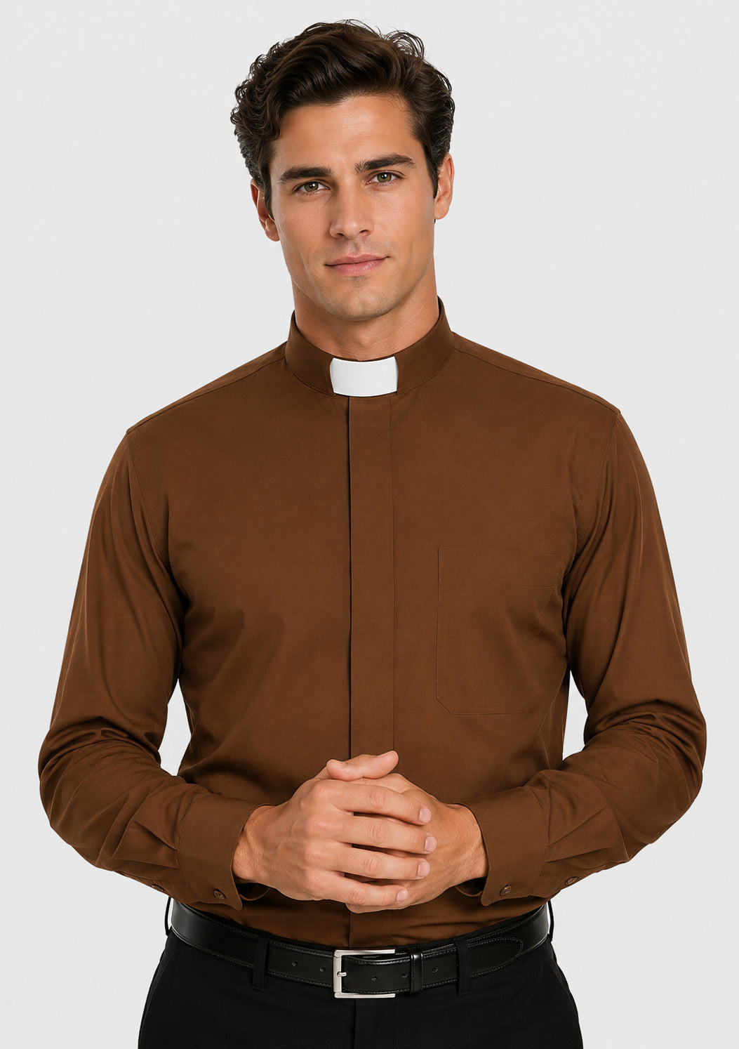 Man wearing a brown clerical shirt with a white collar on a gray background