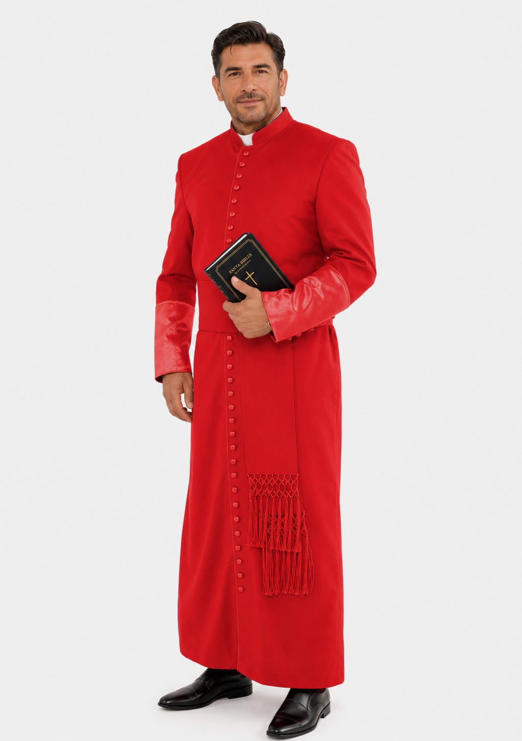 Man wearing a red robe holding a holy book on a white background