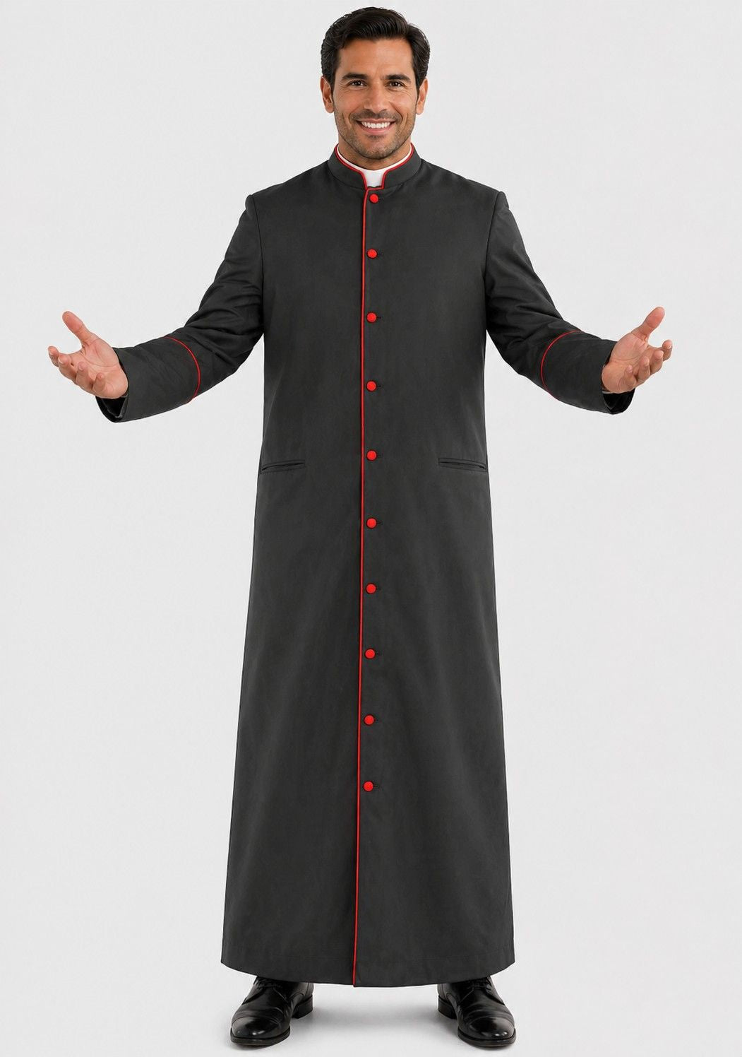 Man wearing a long black robe with red buttons on a white background