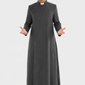 Man wearing a gray priest's robe on a white background