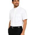 Man wearing a white clerical shirt with a white collar on a white background
