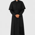 Man wearing a black priest's outfit on a white background