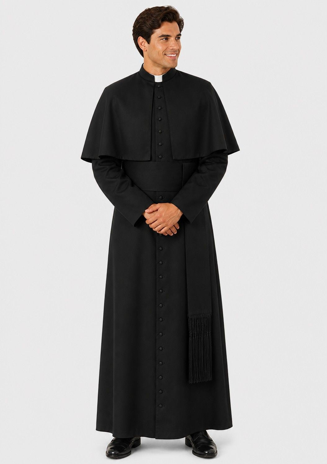 Man wearing a black priest's outfit on a white background