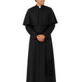 A man modeling a black priestly  robe with a collar, standing against a plain white background.