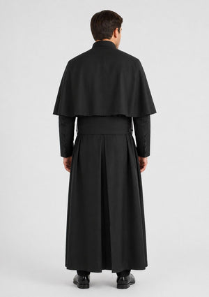 Man wearing a black long cassock on a white background