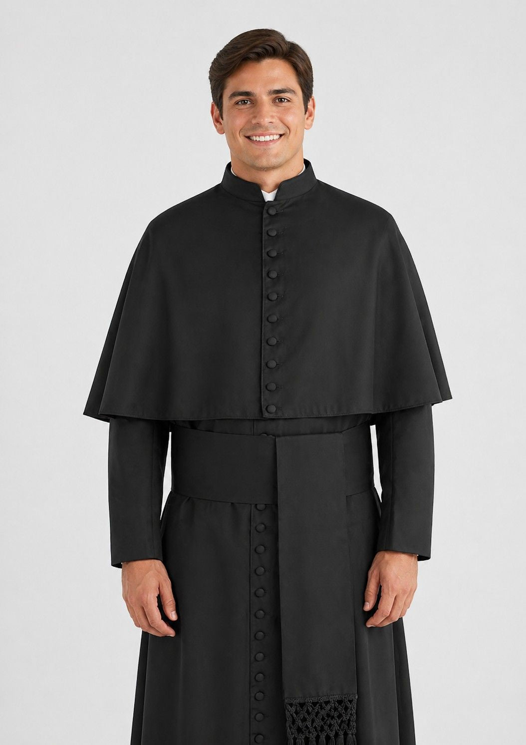 Man wearing a black religious robe on a white background