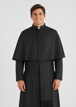 Man wearing a black religious robe on a white background