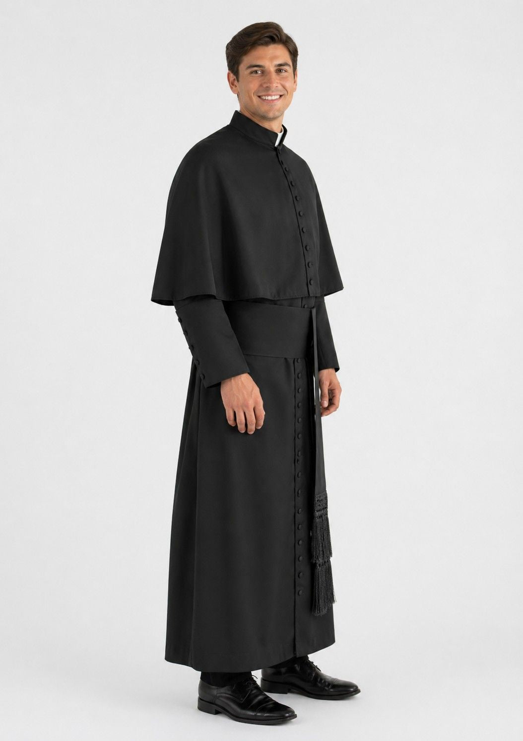 Man wearing a black religious robe on a white background