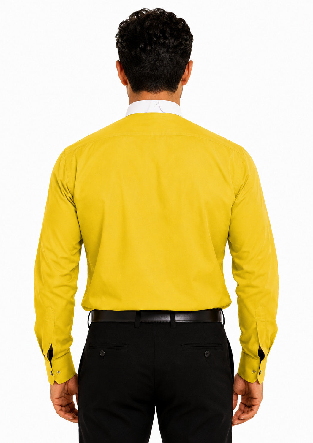 Man wearing a yellow clerical shirt and black pants on a white background