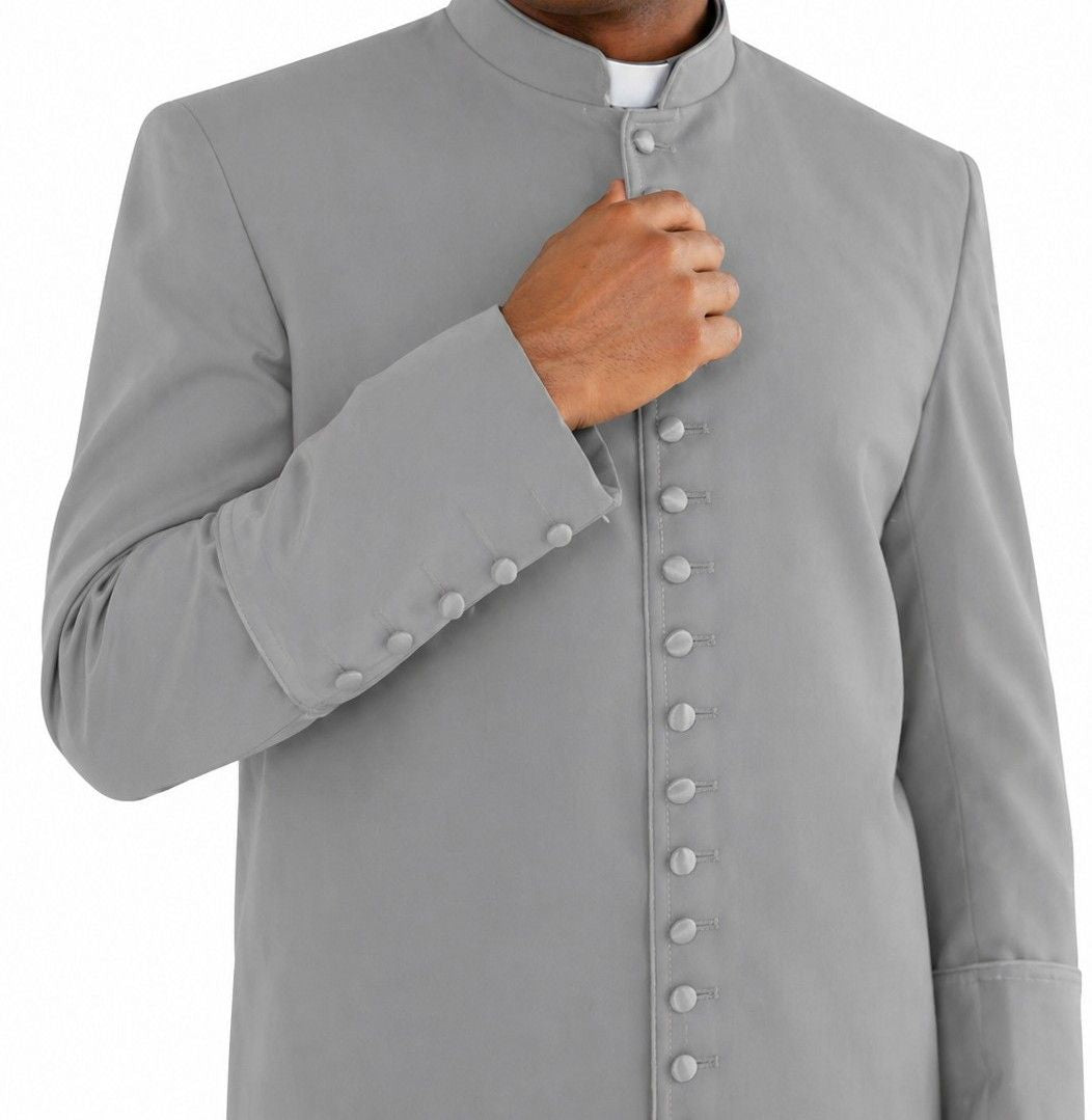 Man wearing a long gray coat on a white background