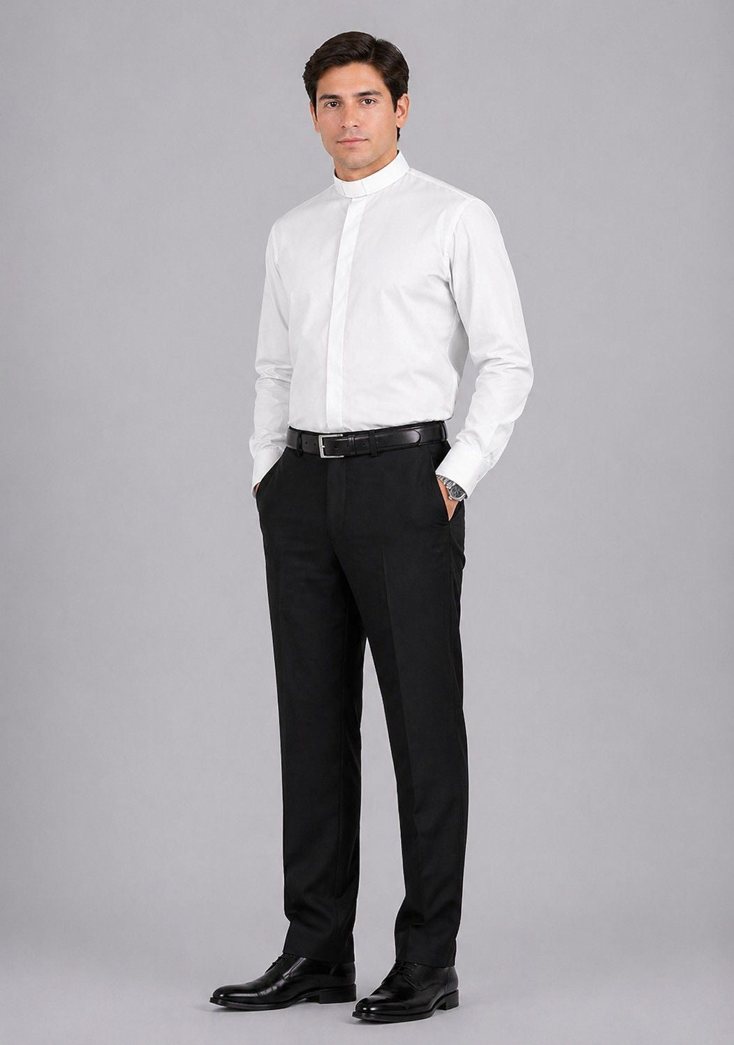 Man wearing a white dress shirt and black pants on a gray background