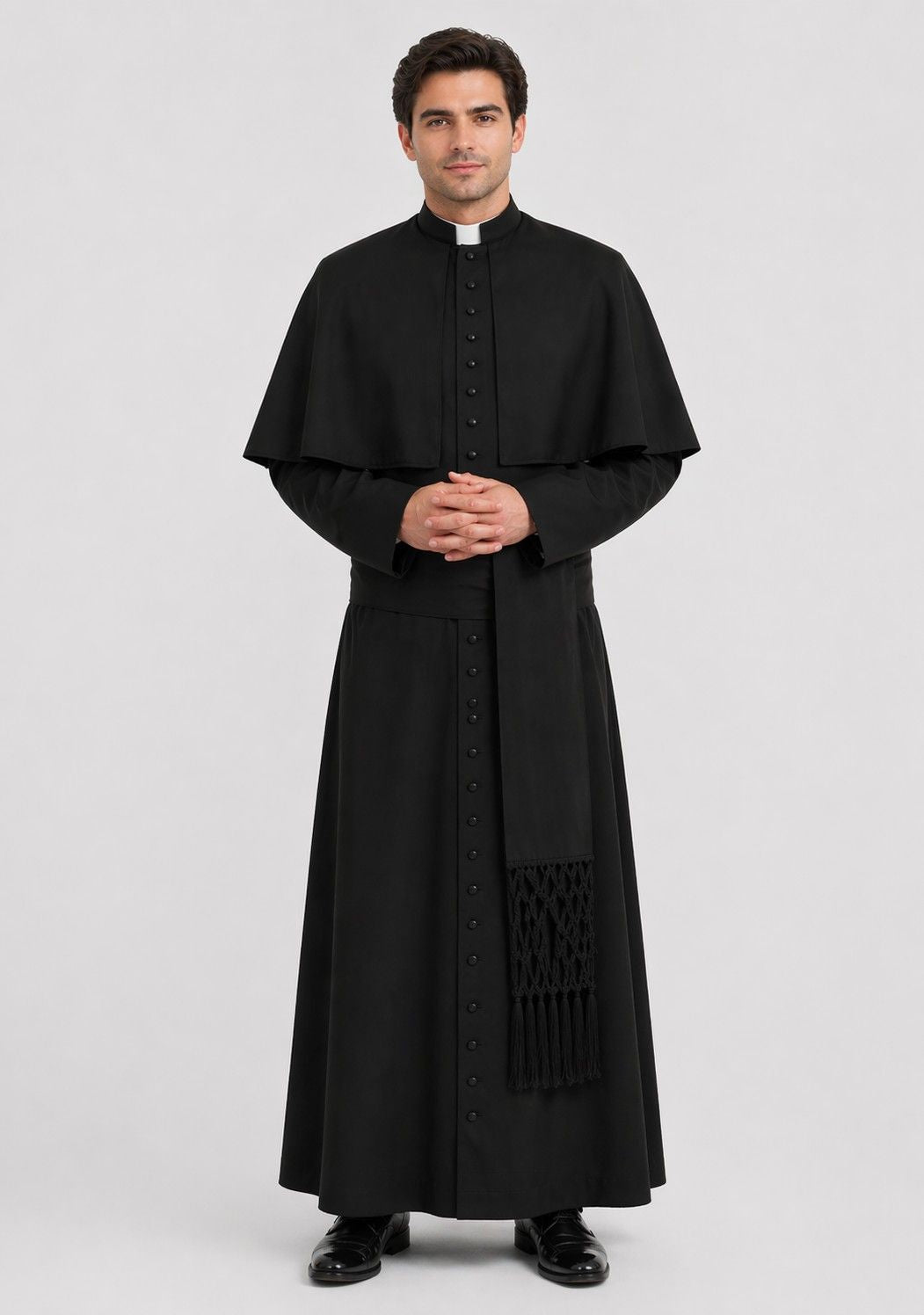 Man wearing a black priest's robe on a white background