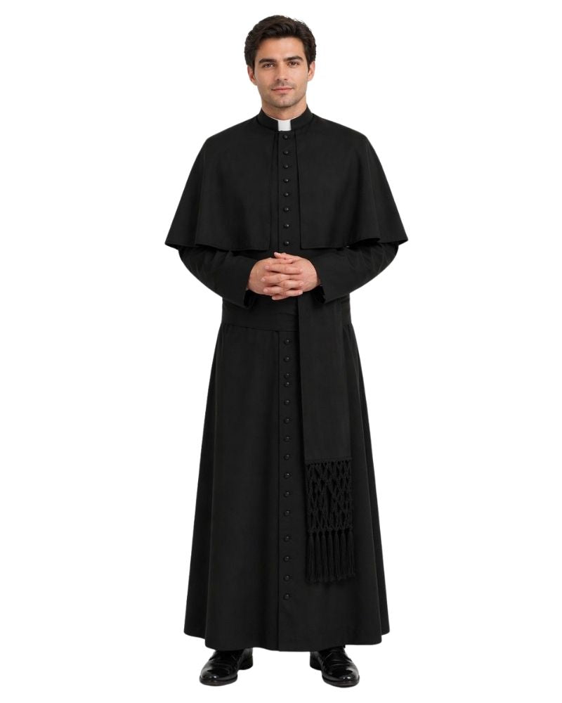A man modeling a long black clerical cassock with a high collar, front buttons, and a draped scarf detail, shown against a plain white background.