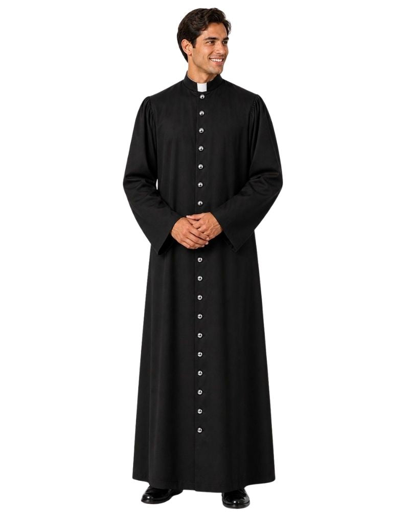 A man modeling a long-sleeved black clerical cassock with a high collar and a white clerical collar tab at the neck, standing against a plain white background.