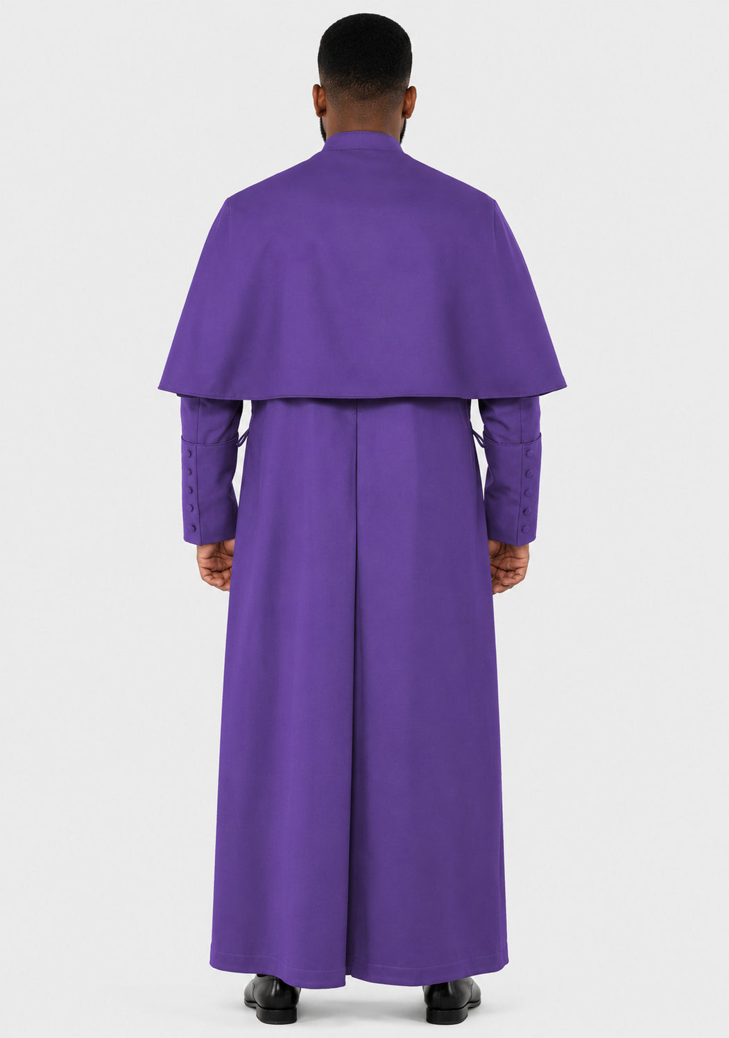 Man wearing a purple liturgical vestment on a white background