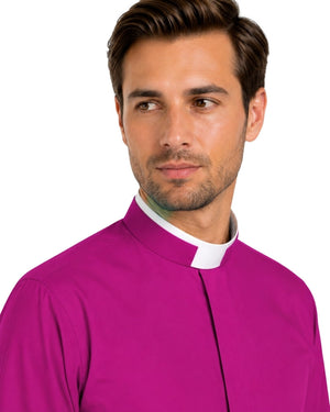Man wearing a bright magenta shirt and black pants on a white background