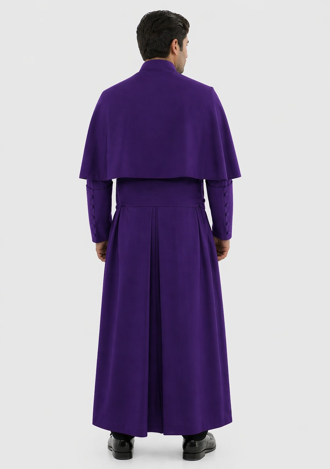 Man wearing a long purple robe on a white background