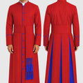 Red robe with blue accents worn by a model on a white background
