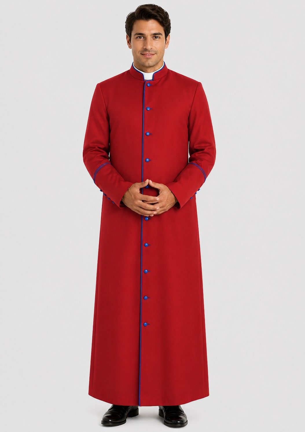 Man wearing a red robe with blue buttons on a white background