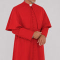 Man wearing a red religious robe on a white background