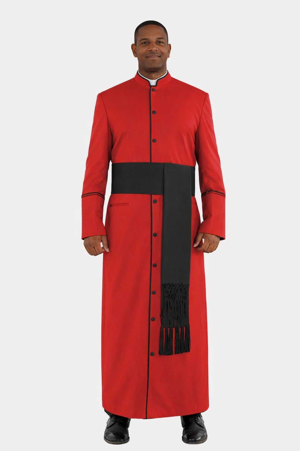 Man wearing a red and black traditional outfit on a white background