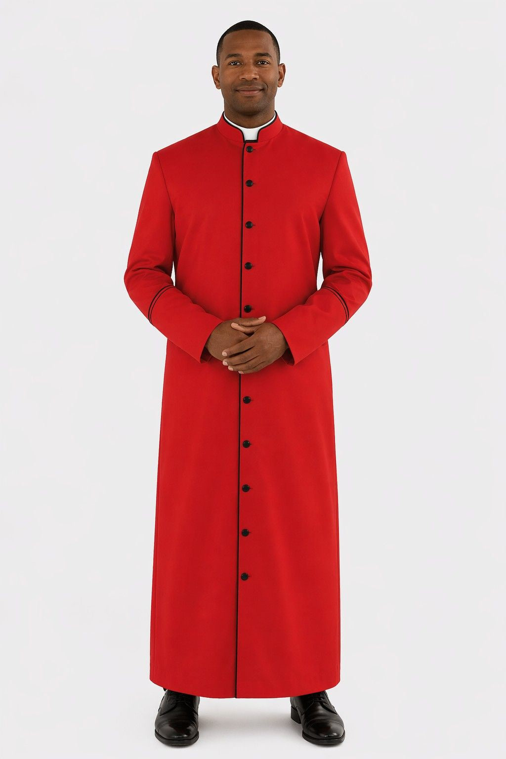 Man wearing a red cassock with black buttons on a white background