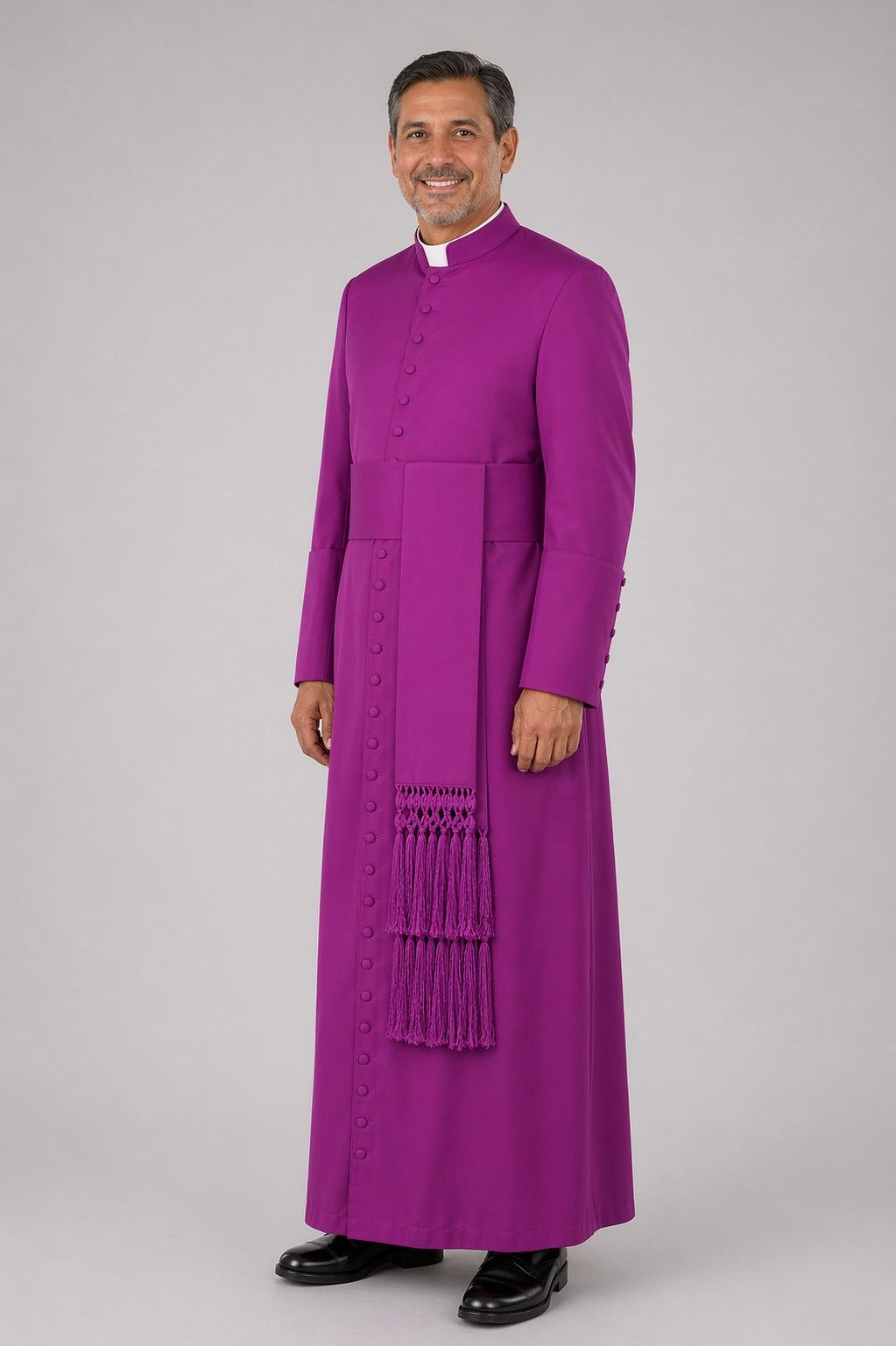 Man wearing a purple robe on a gray background