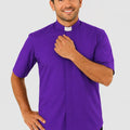 Man wearing a purple shirt with a clerical collar on a gray background
