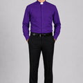 Man wearing a purple shirt with a clerical collar and black pants on a white background