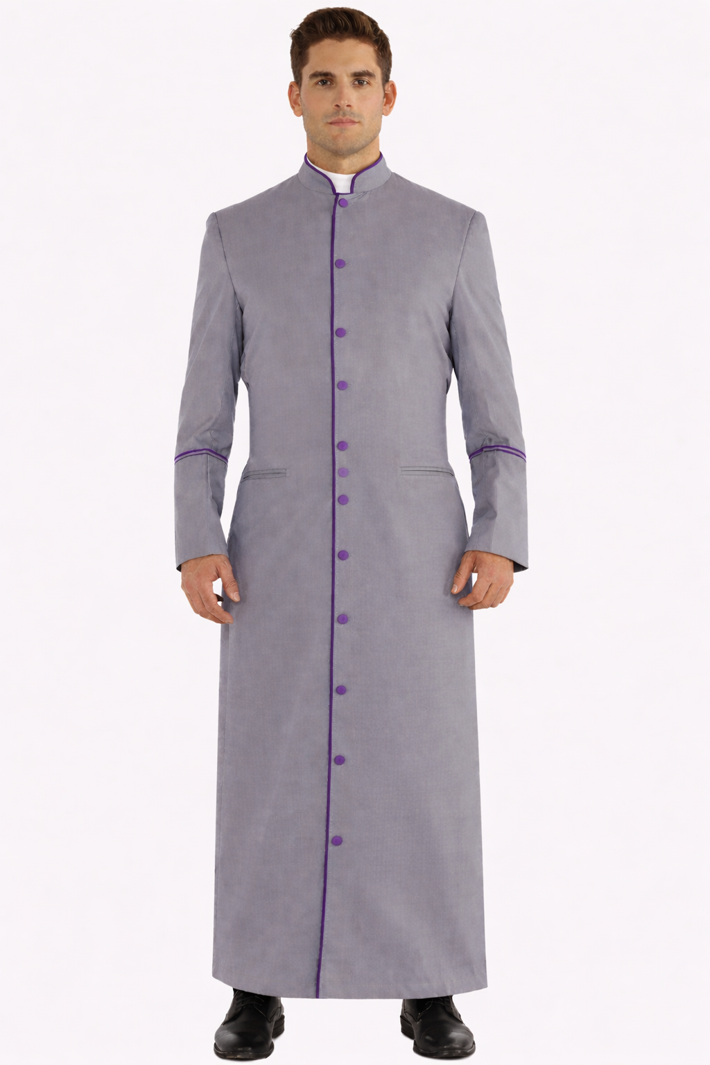 Man wearing a long gray robe with purple accents on a white background