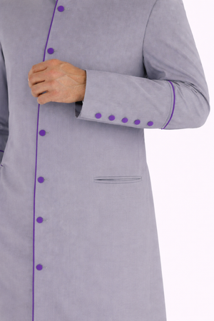 Gray robe with purple accent hand closeup 
