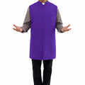 Man wearing a purple vest over a gray shirt on a white background