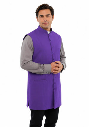 Man wearing a purple vest over a gray shirt on a white background