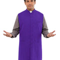 Man wearing a purple vest over a gray shirt on a white background
