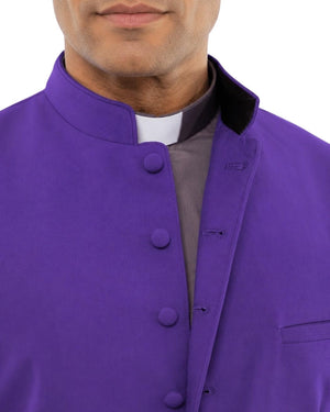 Man wearing a purple vest over a gray shirt on a white background