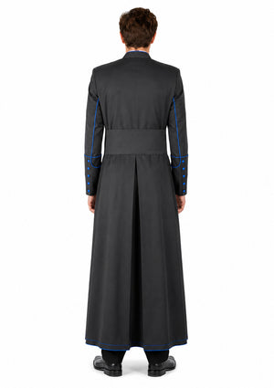 Man wearing a long black robe with blue accents on a white background