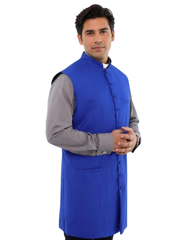 Man wearing a blue vest over a gray shirt on a white background